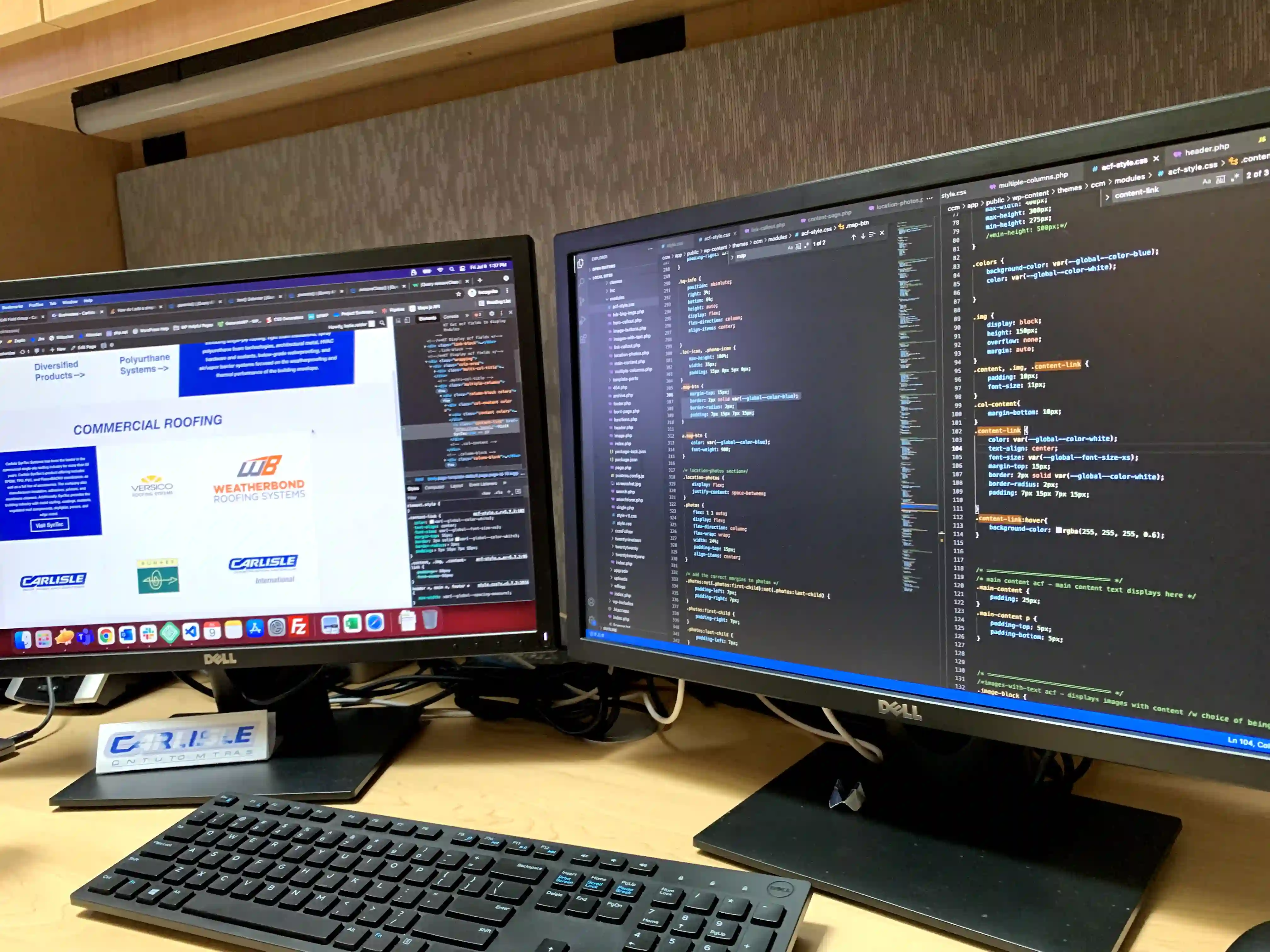 two monitors displaying code